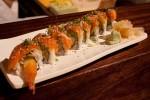 HiroaE™s special roll with avocado, tempura, and salmon.