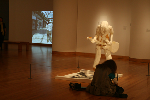 Lone photographer in the gallery.