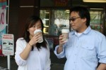 Vicky Ly and Warren Chin drink their coffee before going into Daiso. Everything is $1.50 inside! Warren tells me.
