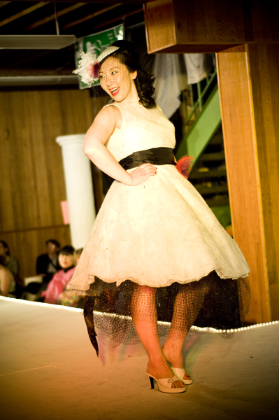 Designer June Park models a fresh style - made of used dryer sheets and the plastic mesh bags oranges come in.