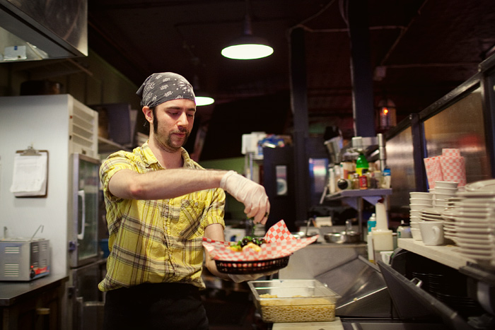 Glenn Smith puts the finishing touches on Irish Nachos at Pies n Pints