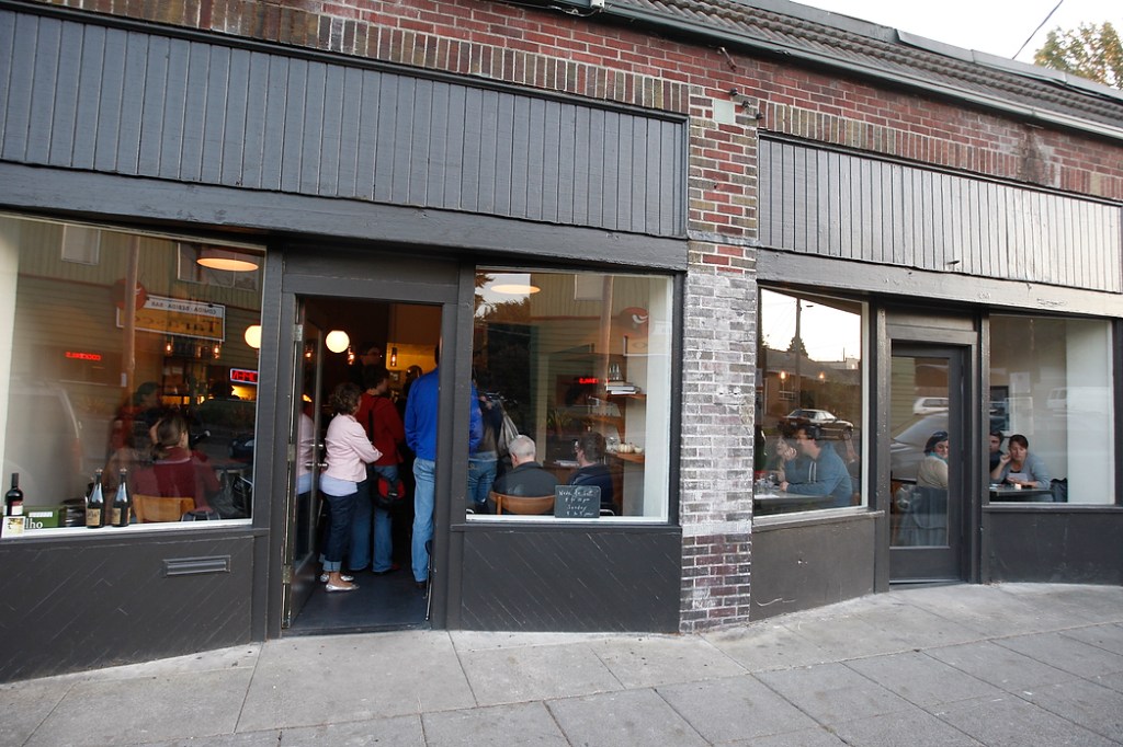 SEATTLE, WA FRIDAY OCT. 4, 2009 Delancey Pizza in Ballard Brandon Pettit unloads a pie from the wood burning oven at Delancey Pizza in Ballard. Pettit owns the restaurant with wife Molly Wizenberg. Photos by Kevin Casey/Seattle Weekly
