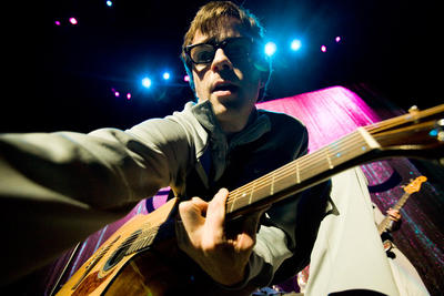 Rivers Cuomo retrieves a guitar pick from our photographer at EndFest 2009.