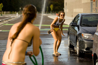 Seattle's Lingerie Football Team, The Mist, have fun during a car wash raising money for breast cancer research.