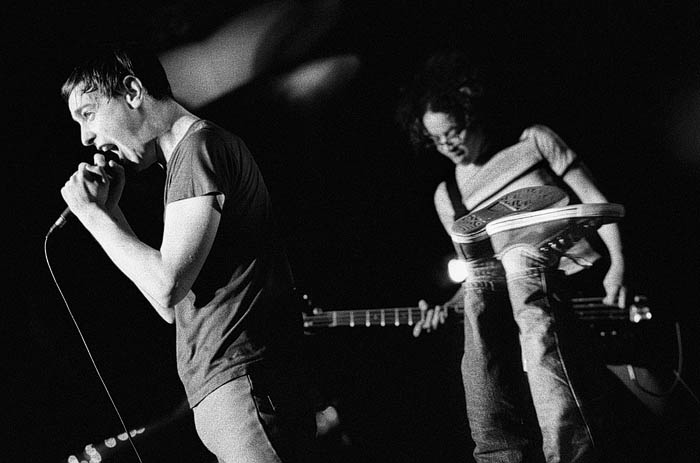 The Thermals, Showbox, Seattle, WA, February 28, 2003: The Thermals had just released a remix of their 4-song demo, the No Culture Icons (which includes the Everything Thermals theme song, my personal favorite), and were opening the show for Death Cab.A  Ben Barnett from Kind of Like Spitting had joined the band on guitar and brought his own stamp of frenetic energy to the performance.A  One moment I had him framed up with Hutch and KathyA  in the shot and the next his back was on the ground, with his chucks dangling in the air where his torso had been. The Thermals go right to your head. The Thermals have sex in your bed. Everything in circles...