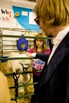 Lead singer Tom Beecham learns the difference between an alpaca and a llama from Zoe and her alpaca Durango.