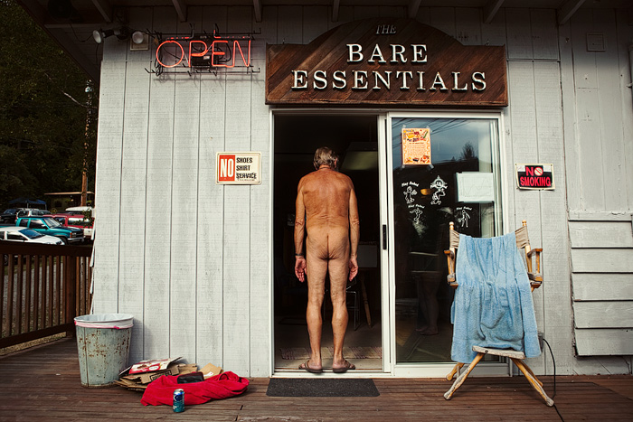 One of the oldest members of the club (he's been here over 50 years) enters the on-site convenient store, Bare Essentials.  Reading materials and sunscreen are two popular items to purchase.