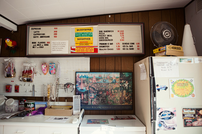 Inside Bare Essentials.  One of the bumber stickers reads, If God had meant us to be nude, we'd have been born that way.