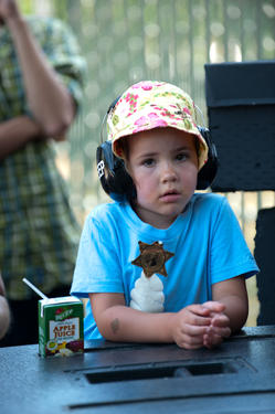 Summer concert checklist: apple juice, sheriff badge, ice cream shirt, summer hat, protective earwear. Perfect for the No Depression Festival on July 11.