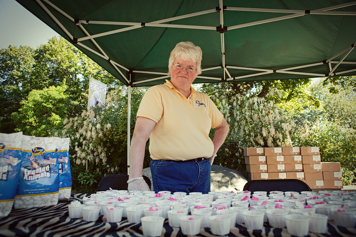 Sue works the table for Franz's Red White & Zoo 4th of July weekend celebration.