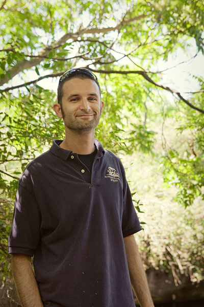 Matt can usually be found taking care of the giraffes but today he's helping a staff member feed watermelons to the hippos.