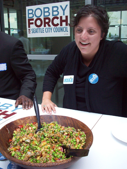 Oh, you're the David taking on Goliath, a woman told Jessie Israel while dishing up her salad concocted with a variety of legumes and vegetables she got at the Pike Place Market. After a few bites the woman decides Israel has hit the jackpot. Maybe there's a lesson in this for long-shot challengers to entrenched incumbents. Winning on the issues is very difficult, but perhaps your command of local ingredients will sway the electorate.