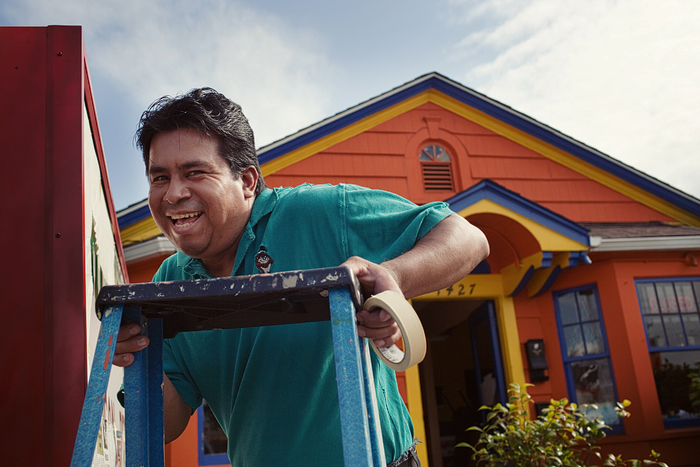 Martin gets ready to re-paint the sign at Chile Pepper's Mexican Restaurant.