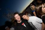 War Room co-owner Brian Rauschenbach (right) celebrates with friends on the balcony.
