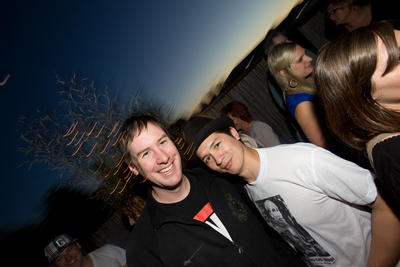 War Room co-owner Brian Rauschenbach (right) celebrates with friends on the balcony.