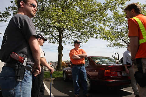 A group from OpenCarry.org pick up trash along their area along Interstate 5 Freeway near Fife as part of the Adopt-A-Highway program on Sunday, May 17, 2009. The group supports the right to carry a firearm . (Kevin P. Casey/Seattle Weekly)