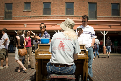 Jonny Hahn a.k.a. The Piano Man makes music of his own a few cheese tents over.