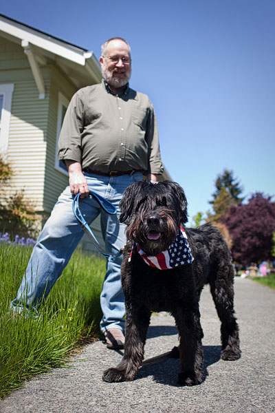Bruce and his 12-year-old Bouvier, Tess, walk around the neighborhood.