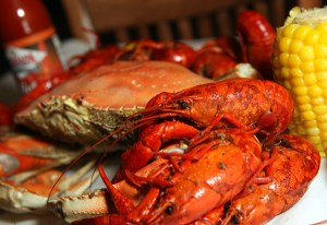 Patrons eating the Cajun Crawfish specialty and Trieu Dinh at Crawfish King in Seattle on Sunday May 3, 2009. (Kevin P. Casey/Seattle Weekly)