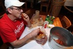 Jim Cummings eating the Cajun Crawfish specialty and Trieu Dinh at Crawfish King in Seattle on Sunday May 3, 2009. (Kevin P. Casey/Seattle Weekly)