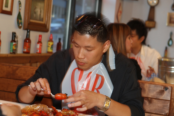 Patrons eating the Cajun Crawfish specialty at Crawfish King in Seattle on Sunday May 3, 2009. (Kevin P. Casey/Seattle Weekly)
