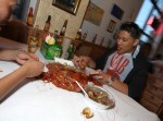 Patrons eating the Cajun Crawfish specialty and Trieu Dinh at Crawfish King in Seattle on Sunday May 3, 2009. (Kevin P. Casey/Seattle Weekly)