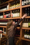 Ayse picks out wine for diners at Olive You Mediterranean Restaurant.
