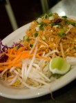 At Tup Tim Thai a pale peach-colored chicken pad thai, just oily enough to leave the plate glossy, greeted me like an old friend.