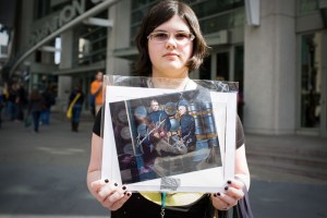 Showing off her framed Battlestar Galactica print.