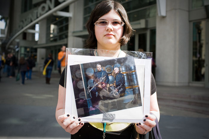 Showing off her framed Battlestar Galactica print.