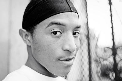 In the Central District, Jakele takes a smoke break from his job at the Catfish Corner.