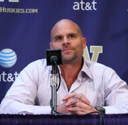 14. One guy who coaches linebackers will earn more than a 10-professor department at the University of Washington. The money thrown around by athletic departments has long been a bone of contention at universities, where coaches often make way more than professors. Football programs like the Huskies may bring in their own money through ticket sales and donations, but lavishing millions on something arguably so peripheral to the mission of an institution of higher learning seems wrong when programs at its very core are starving for funds. That's never been truer than now. Earlier this year, the UW hired 46-year-old Nick Holt away from USC to be its defensive coordinator and assistant head coach. Holt's three-year contract is worth $2.1 million, or $700,000 a year. That's more than the amount earned by the entire classics department faculty, consisting of 10 professors. Yet at the same time UW President Mark Emmert (who himself makes $900,000 a year) has been warning of the devastating impact of budget cuts under consideration in Olympia, and academic departments have been told to prepare for as much as an 18 percent reduction. Holt's salary doesn't help us make our case, says Janelle Taylor, president of the UW chapter of the American Association of University Professors.