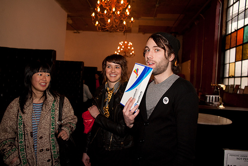 Club booker Eli Anderson tended to his carton of cigarettes (right?).