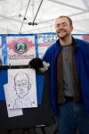 Seattle People features the Ballard Farmer's Market. This caricature artist reveals how he really feels about the rain in a self portrait.