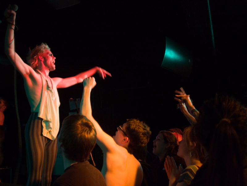 A fan follows suit, disrobing.