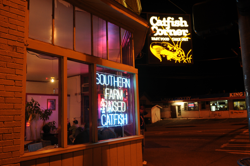 Catfish Corner: Seeing as itaE™s about the only restaurant in Seattle that specializes in catfish, and seeing how catfish is an item of far more succulence than, say, tofu, Catfish Corner has developed quite a loyal following since it first opened in 1985. If the establishment wanted to skate by on rep, it assuredly could, given this favorable set of circumstances. But, thankfully, it doesnaE™t, as a buttery, moist baked Cajun catfish fillet with hush puppies and yams on the side reminded me one recent Wednesday. However predictable the fried stuff might be, any restaurant that makes its own tartar sauce, as Catfish Corner (and almost no one else in town) does, is clearly bent on innovation. Note by MIKE SEELY, Serves: lunch & dinner. 2726 E. Cherry St., 323-4330. CENTRAL DISTRICT , mo-catfish.com