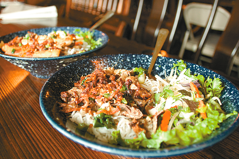 Green Leaf Vietnamese Restaurant: ThereaE™s a reason people are willing to pack in like sardines to eat at this modest family-run place: generous portions that are easy on the wallet. And the chipper servers are more than happy to direct you to their favorite dishes on the menu. (The general consensus: order the vermicelli.)  I heeded their advice and ended up facing a massive bowl of Bun Dac Biet, a vermicelli dish loaded with grilled chicken, pork chop, skewered shrimp, and even a fried egg roll chopped up and thrown into the mix for good measure. Prior to that, IaE™d already munched on some fresh shrimp spring rolls and savory grilled lemon grass mushrooms. It was too much, and my server, sensing I was overwhelmed, wordlessly packed up my food. Note by ERIKA HOBART, Serves: lunch, dinner. 418 8th Ave. S., 340-1388, INTERNATIONAL DISTRICT, greenleaftaste.com