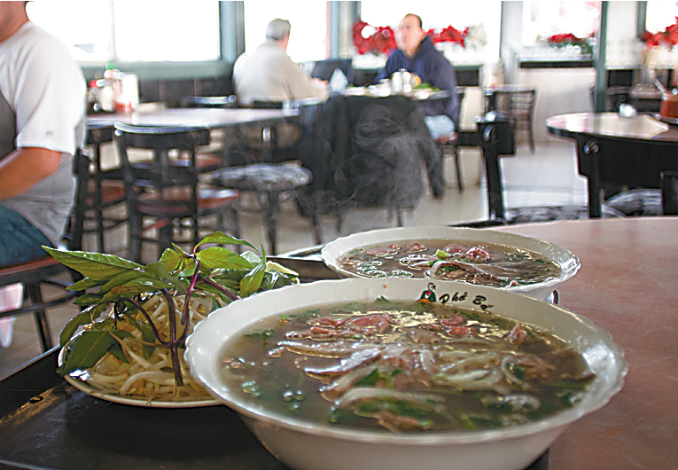 Pho Bac DonaE™t go to Pho Bac for frills. There are no cream puffs, no vegetarian options, and no real plants. Go because youaE™re happy to freeze in Pho BacaE™s little corner shack on a crappy chair for the roughly three minutes it takes the kitchen to prepare your order. YouaE™ll be rewarded with hot Vietnamese noodle soup thataE™s more deeply beefy than other phos in town. Your choices are all cow: thereaE™s tendon and tripe, meatballs and round steak. I choose brisket, knowing IaE™ll scoop in generous servings of the fattiest version right down to the bottom of the bowl. It always melts easily on my tongue, leaving my eyes free to admire the owneraE™s moles, which have the most impressively long hairs IaE™ve ever seen. Note by JESS THOMSON, Serves: Breakfast, lunch, dinner. Multiple locations; 415 7th Ave. S., 621-0532. INTERNATIONAL DISTRICT