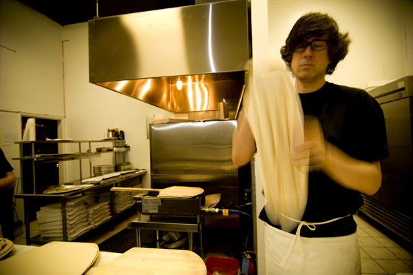 Flying Squirrel Pizza Co.: Flying Squirrel has rocketed to the top of the list of SeattleaE™s pizza places, and in the middle of a pizza glut the likes of which the city has never seen. Part of it is location: Friends who live in Columbia City already have the restaurantaE™s hours memorized, and control their obsession by taking alternate routes home. With its red walls, uneven furniture, and vintage-store paintings, Flying Squirrel looks like it belongs in the U District. Owner-pizzaiolo Bill Coury sources ingredients from local producers when possibleaE”ZoeaE™s Meats, Molly Moon ice creamaE”and can put together a froufrou pie with goat cheese, zucchini, and roasted red peppers to meet the demands of the most discerning PCC customer. But with every pie he keeps in mind that toppings, no matter how organic, play second fiddle to the crust. He's got a good one: solid enough to support sauce and a few toppings without caving at the center, solid enough to crease and crack when you pick up a wedge, and still bubbly and airy around the lip. Note by JONATHAN KAUFFMAN; Serves: dinner. 4920 S. Genesee St., 721-7620, COLUMBIA CITY, flyingsquirrelpizza.com