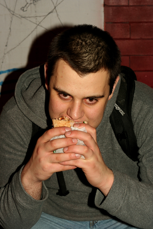 Eating the shit out of a pita.