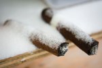 Cigars left in a COVERED area were not spared the snow.