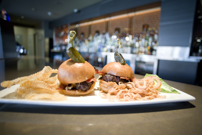 Finger food aE“ like these sliders aE“ are designed to be eaten painlessly in the dark of the theater.