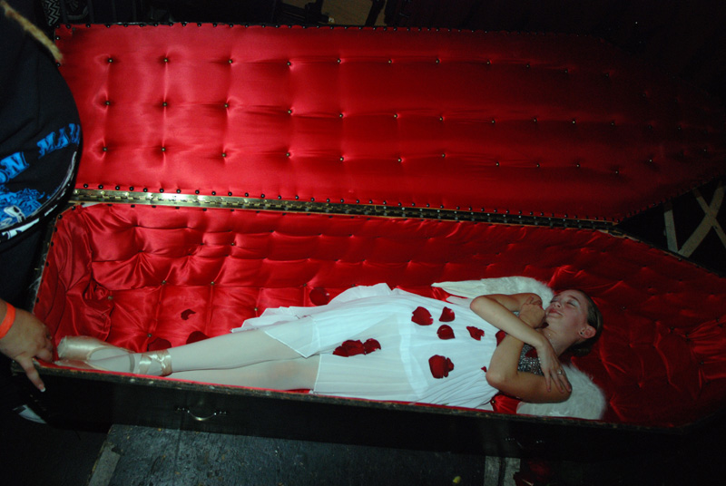 And then she is returned to her coffin, and covered in rose petals.