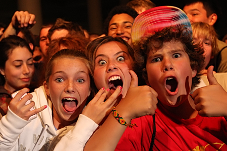 Bumbershoot Fans of the Day: Sunday: Julia, center aE” age 16, was my Bumbershoot Sunday top pick for Fan of the Day. I caught up with her waiting for Brother Ali at the Exhibition Hall Stage, and she'd been around long enough to make it front and center aE” which is dedication in and of itself. I don't know if I've ever heard someone scream that loud before. There are tons of underage at Bumbershoot, but if they're like her I'd say they've earned a place.