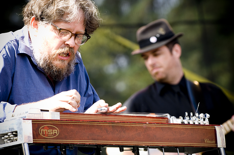 Jon Rauhouse plays pedal steel behind Neko Case.