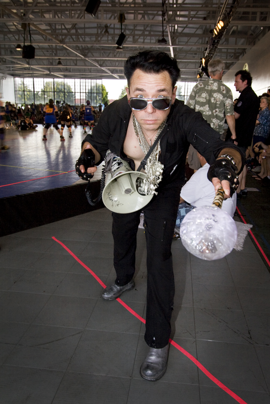 Rocketman Houllahan (mascot for the Throttle Rockets) gives a little grease.