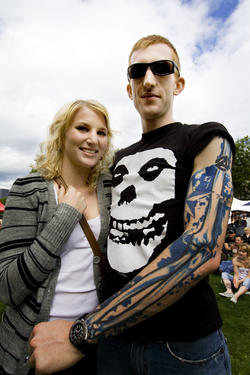 Seattle People: First Week of August: From Seattle Tattoo Expo aE“ Nathan and his lady friend Michelle watch the Best Tribal Tattoo contest; # of tats: 2 partially done sleeves; Most painful spot: That inside part of the upper arm.