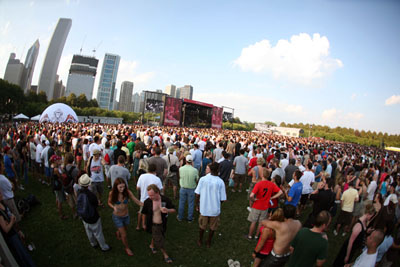 The Chicago skyline looms over concert-goers at Lollapalooza, August 1, in Chicago, Illinois.