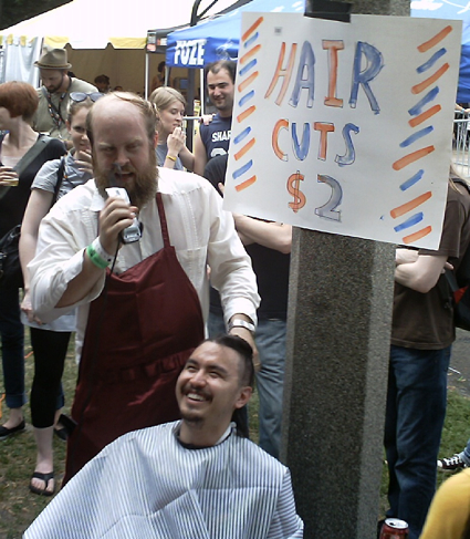 Pitchfork Day Two: No festival experience is complete without a $2 haircut by Les Savy Fav's Tim Harrington.
