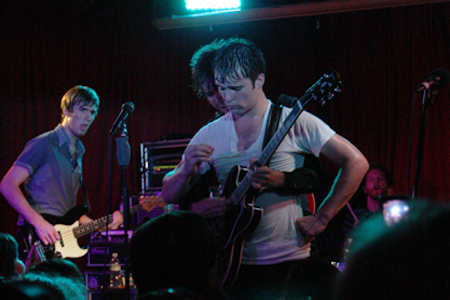 Jesse Laz plays guitar from behind the back of Kai Kennedy aE” I wasn't kidding when I said these guys had a good time on stage.
